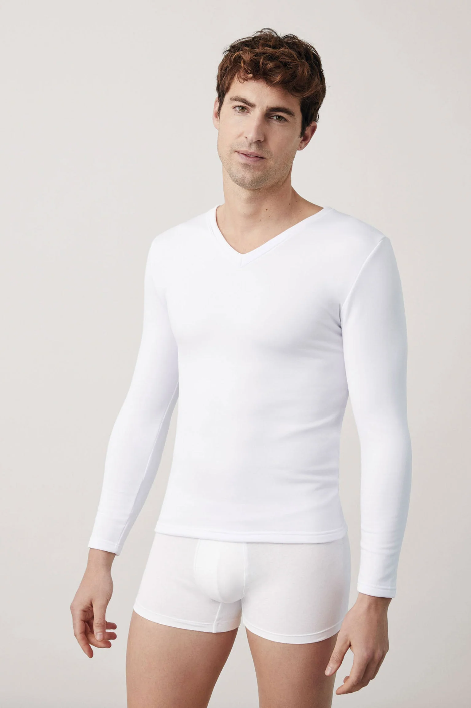 Maglia termica bianca a maniche lunghe con scollo a V
