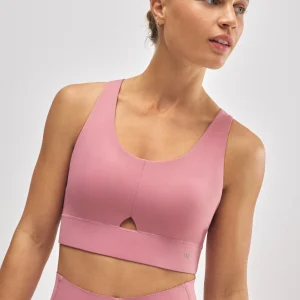 Reggiseno sportivo compressivo rosa con dettaglio di apertura